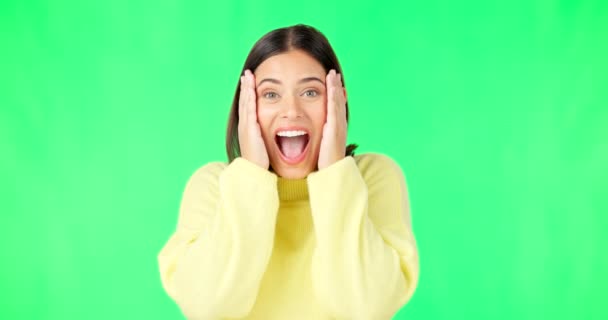 Green screen, surprise and wow face of woman for news, announcement and deal information in studio. Excited, happy and portrait of isolated girl smile with shocked, emoji and omg facial expression. - Кадры, видео