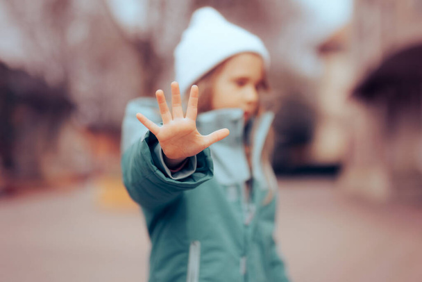 Unhappy Preschool Little Girl Making a Stop Bullying Gesture - Foto, afbeelding
