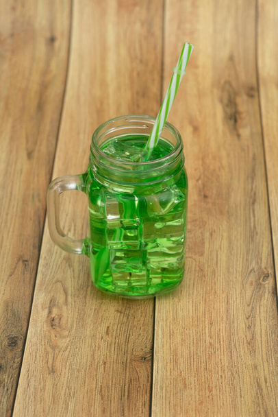 Lemonade summer cold drink with wooden background - Foto, Imagen