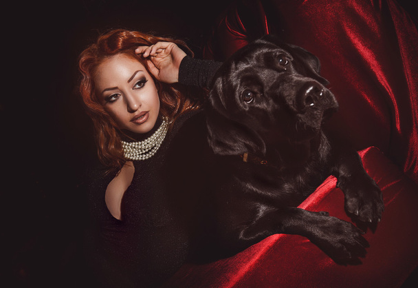 Beautiful woman with black dog - Valokuva, kuva