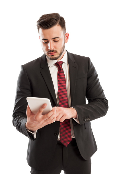 Suited business man using a tablet - Foto, Imagen