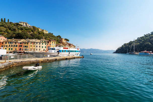 Famous village of Portofino, luxury tourist resort in Genoa Province, Liguria, Italy, Europe. Port and colorful houses, Mediterranean sea (Ligurian sea). - Zdjęcie, obraz