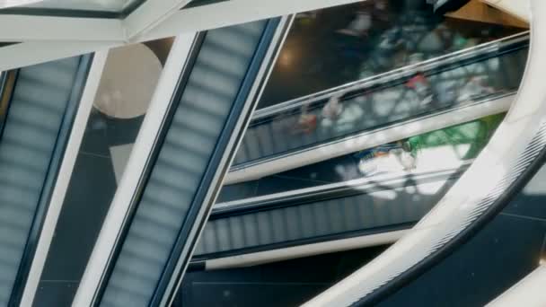 People on escalator in shopping center - Footage, Video