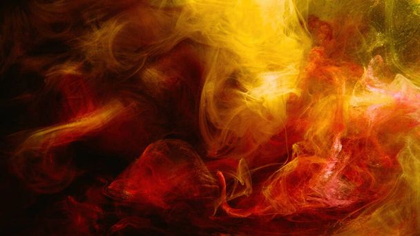 Color smoke. Paint water mix. Fire flame. Red yellow burning glowing glitter vapor texture on dark black abstract art background with free space. - Foto, imagen