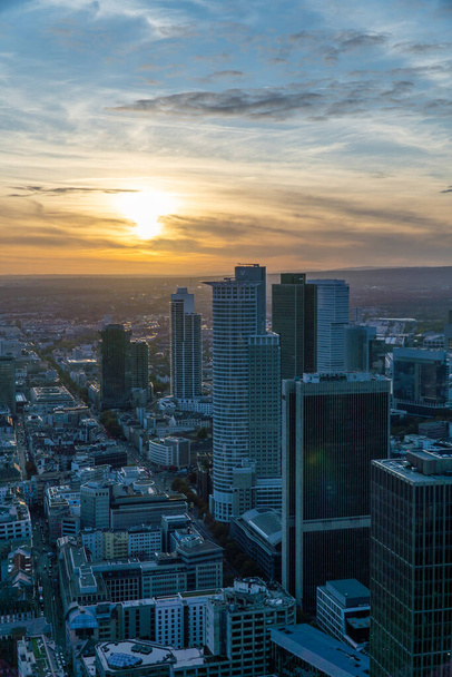 Aerial view of the Frankfurt skyline during sunset. Modern building reflecting the last sunligh of the day. - Фото, зображення