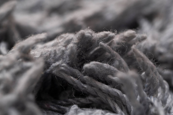 Texture of gray wool, macro cotton wool, gray natural sheep wool, texture, dark carpet, close-up, gray fleece, - Fotó, kép