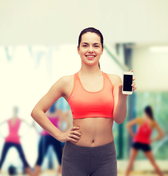 sporty woman with smartphone - Photo, image