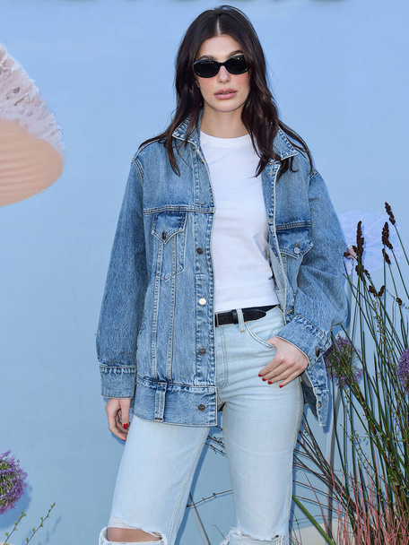 Camila Morrone arrives at the REVOLVE Festival 2023 celebrating the 20th Anniversary of REVOLVE in partnership with The h.wood Group on April 15, 2023 in Thermal, Coachella Valley, Riverside County, California, United States.  - Фото, изображение