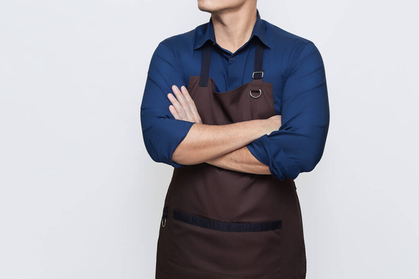 Asian Man wearing apron in casual stylish clothing, standing upright pose with folded hands, confident and calm gesture, no face isolated white background - Photo, Image