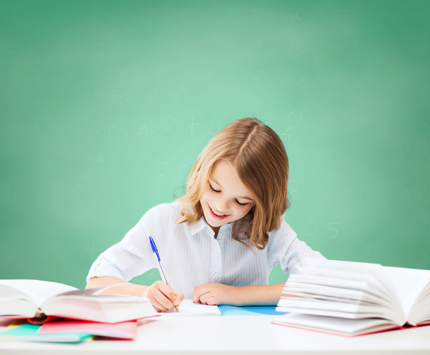 happy girl with books and notebook at school - Φωτογραφία, εικόνα