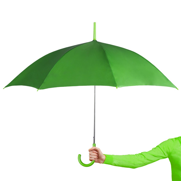 Green umbrella in hand - Foto, Imagen