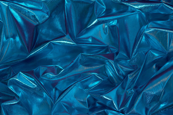Abstract blue crumpled foil background. Minimal party concept. - Fotó, kép