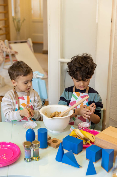 Kids prepering food in the montessori  kindergarten,  banana cokies - Fotoğraf, Görsel