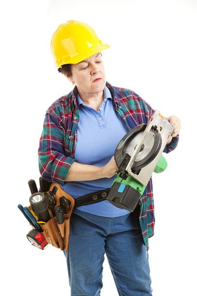 Female Worker Repairs Saw - 写真・画像