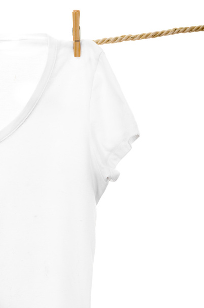 white tshirt hanging on a rope clothesline - 写真・画像
