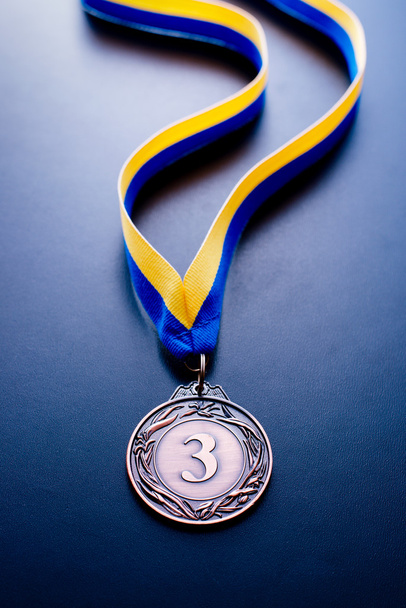 Bronze medal on a blue background - Photo, Image