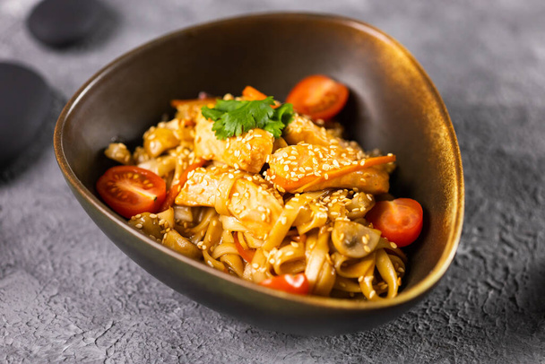 Udon stir-fry noodles with chicken and vegetables. Asian cuisine - Photo, Image