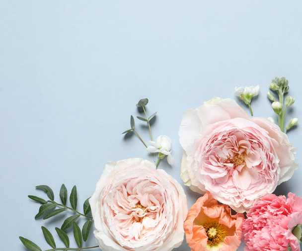 FLat lay composition with different beautiful flowers on light grey background. Space for text - Foto, afbeelding