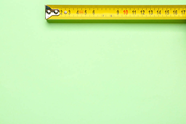 Measuring tape on green background - Photo, Image