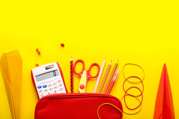Composition with stationery supplies and paper planes on yellow background - Photo, Image