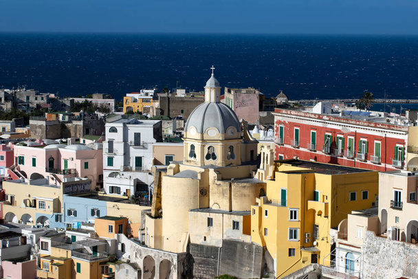 View of the Port of Corricella with lots of colorful houses on a sunny day in Procida Island, Italy. - Fotografie, Obrázek