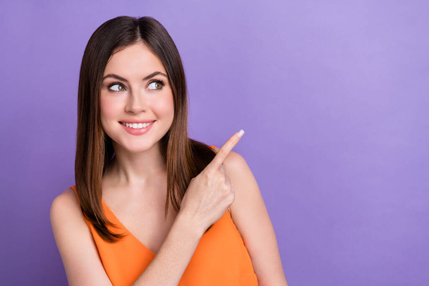 Photo of gorgeous cheerful person toothy smile look direct finger empty space isolated on violet color background. - Foto, Imagen