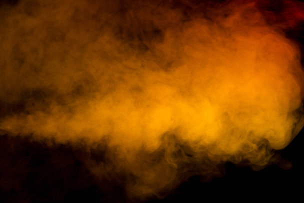 Orange and red steam on a black background. Copy space. - Foto, immagini