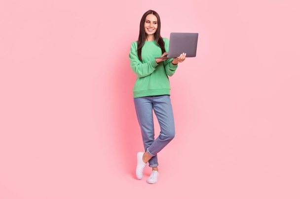 Full length photo of cheerful gorgeous lady wear stylish clothes speaking friends skype telegram isolated on pink color background. - Foto, afbeelding