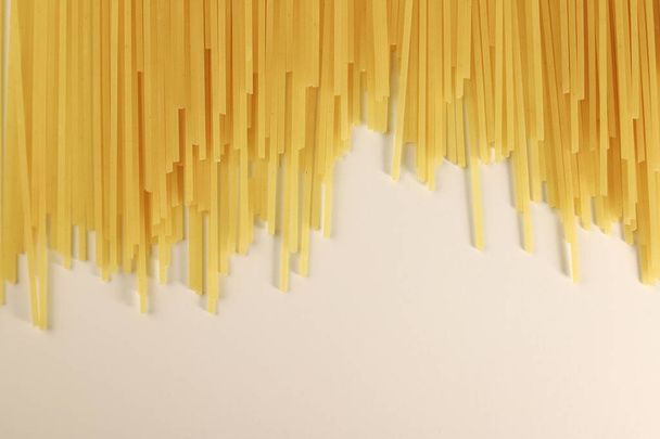 durum wheat pasta in a glass on a white background. for banners, advertisements, splash screens, labels and more - Fotografie, Obrázek