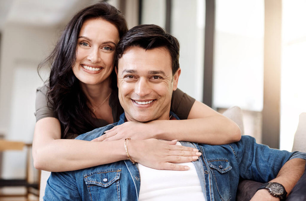 My hubby, my happiness. a happy young couple embracing at home - Фото, изображение
