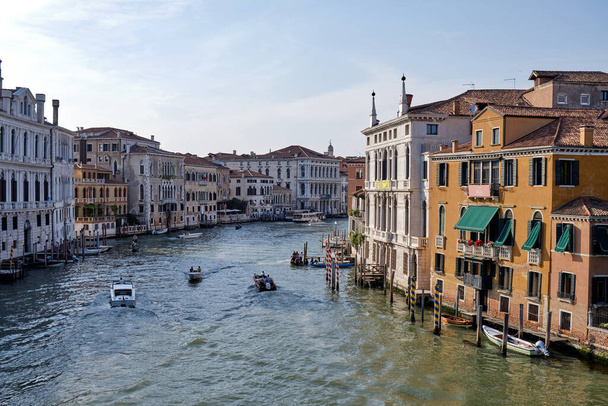 Venice, Italy: Panorama of Venice Grand Canal with boats and Santa Maria della Salute church on sunset from Ponte dell'Accademia bridge. - Foto, Imagem