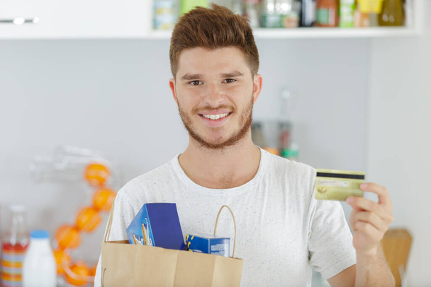 young man and grocery shopping concept - Photo, image