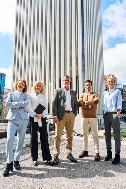 Vertical photo of business people standing proud and looking at camera in a financial district - Valokuva, kuva