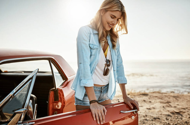 Some days just inspire you to hit the road. a beautiful young woman going on a road trip to the beach - Photo, Image