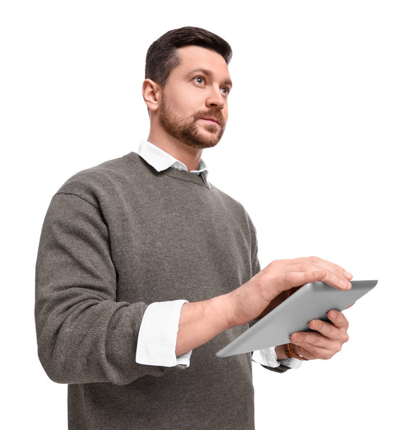 Handsome bearded businessman using tablet on white background, low angle view - Φωτογραφία, εικόνα