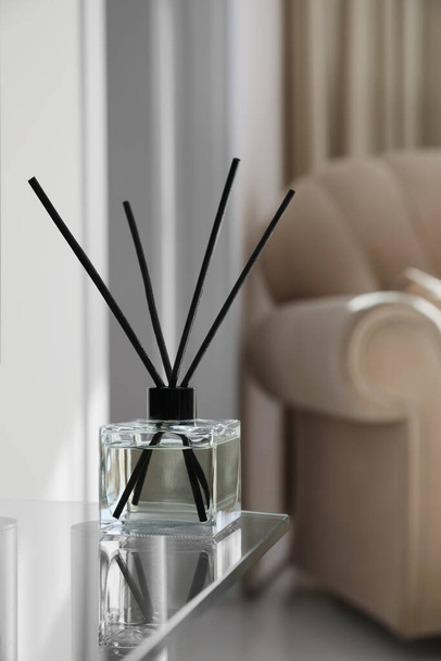 Aromatic reed air freshener on table indoors, space for text - Foto, Imagem