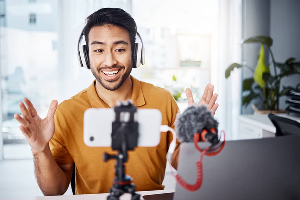 Podcast, happy and live streaming with a man content creator recording a broadcast in his home office. Internet, freelance and subscription with a male vlogger or creator working in his studio. - Valokuva, kuva