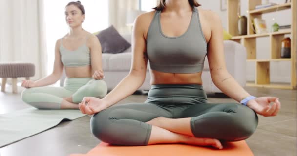 Lotus, morning meditation and women in a living room, calm mindfulness and balance on the floor. Fitness, wellness and friends sitting together for spiritual training, stress relief and zen exercise. - Footage, Video