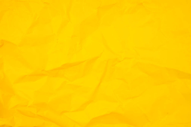 Abstract background from crumpled yellow paper texture. - Foto, Imagem