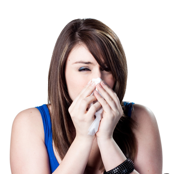 donna soffiando il suo naso - Foto, immagini