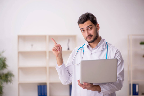 Young doctor in telemedicine concept - Photo, Image