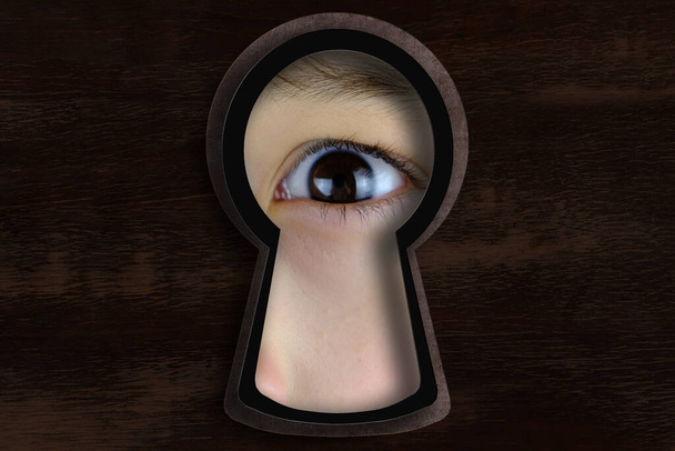 keyhole hole with Human eye, Young child 10-12 years looking straight, covertly is following, drops of liquid, texture is dark, concept of secrecy, spying, Surveillance System, face Recognition - Photo, image