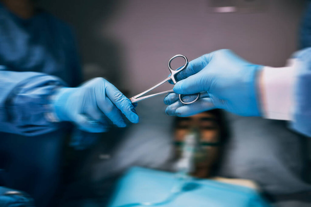 Hospital scissors, surgery and doctors hands in theatre for medical support, teamwork or patient with healthcare zoom. Doctor, nurse or surgeon team work, giving tools and helping in operating room. - 写真・画像