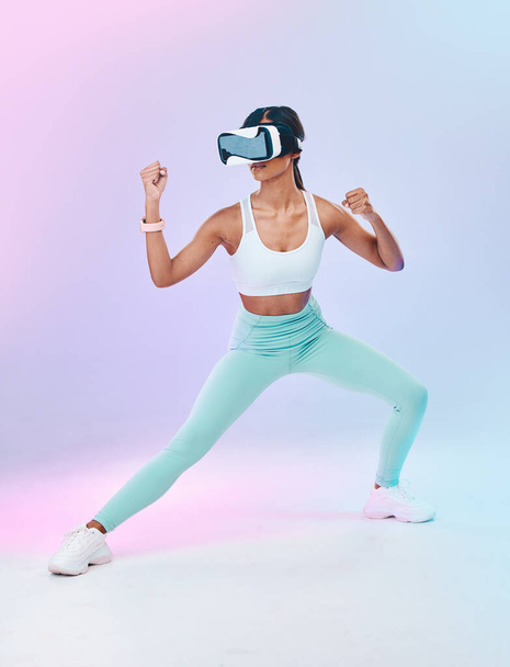 Fitness, VR glasses and woman isolated on gradient background for metaverse fight, gaming and sports training. Virtual reality, online vision and action 3d boxer or person body, workout competition. - Φωτογραφία, εικόνα