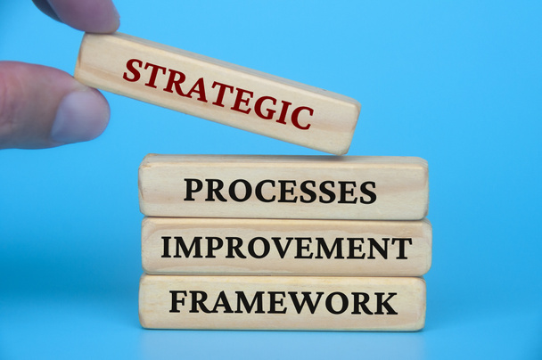 Strategic process improvement framework text on wooden blocks. Business culture and Operational excellence concept. - Photo, Image