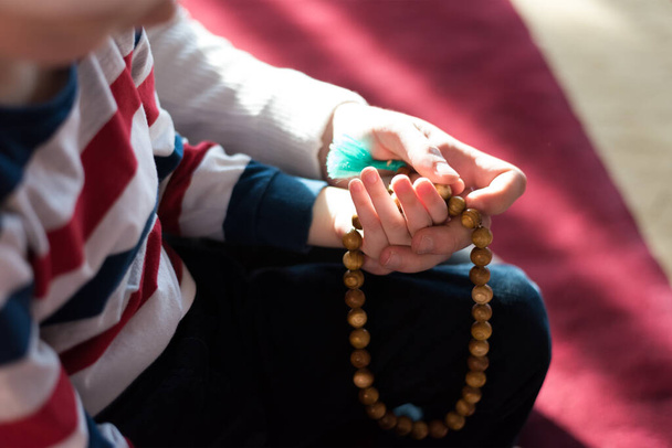 Islamic, community or people in praying with boy or kid for Gods support, spiritual peace during ramadan - Foto, Bild
