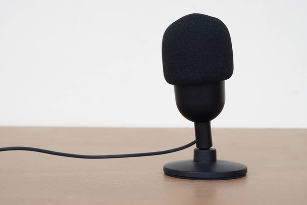 Black microphone. Concept, technology device, microphone usb, useful for sound, voice recording, live streaming. On air, broadcasting.           - Фото, изображение
