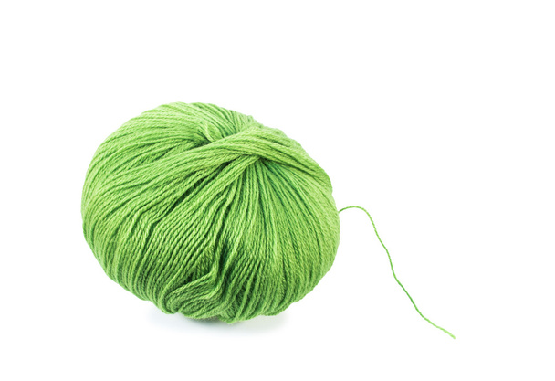 Зелена вовняна кулька з пряжі
 - Фото, зображення
