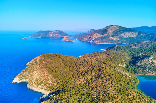 Aerial view of mediterranean azure sea with mountain island - Фото, зображення