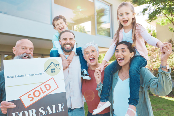 Real estate, portrait and happy family outside of new house, excited and smiling in a garden. Property sign, sale and kids, parents and grandparents celebrating and moving into dream home in the yard. - Photo, Image